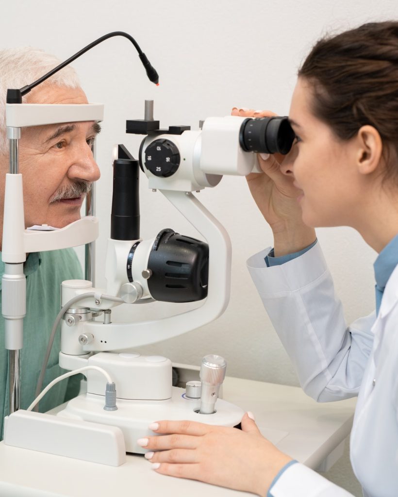 young-brunette-female-ophthalmologist-testing-eyesight-of-senior-male-patient.jpg